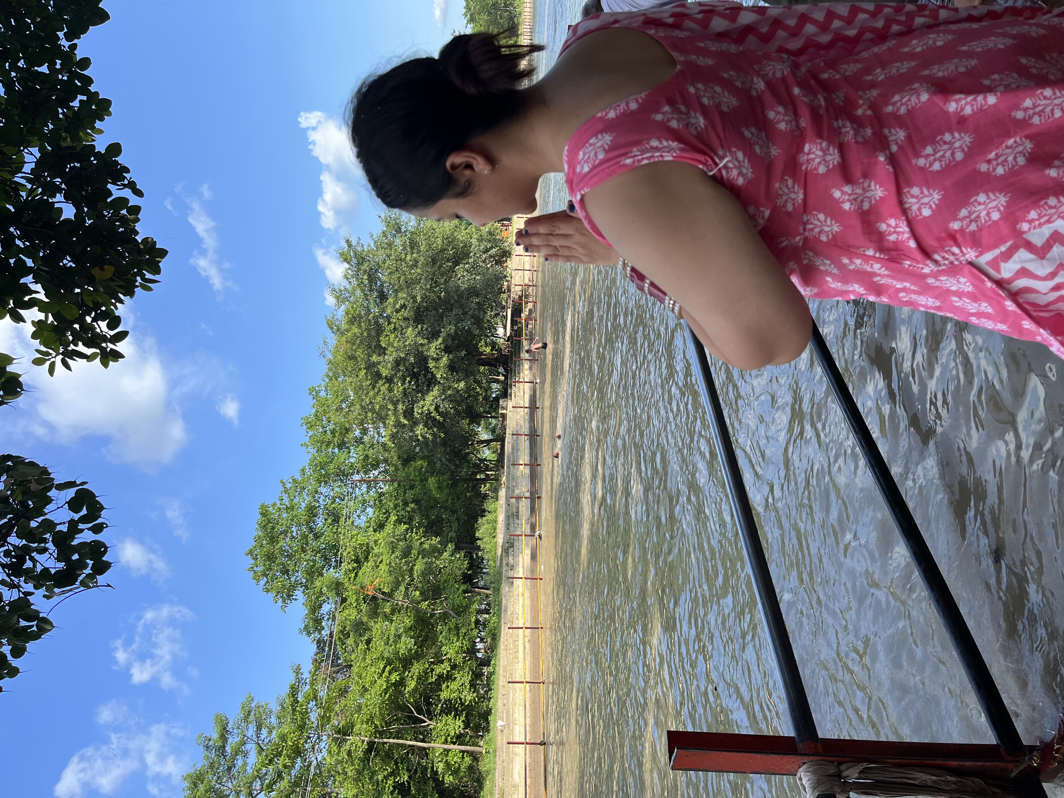 Yashna in namaste beside a river